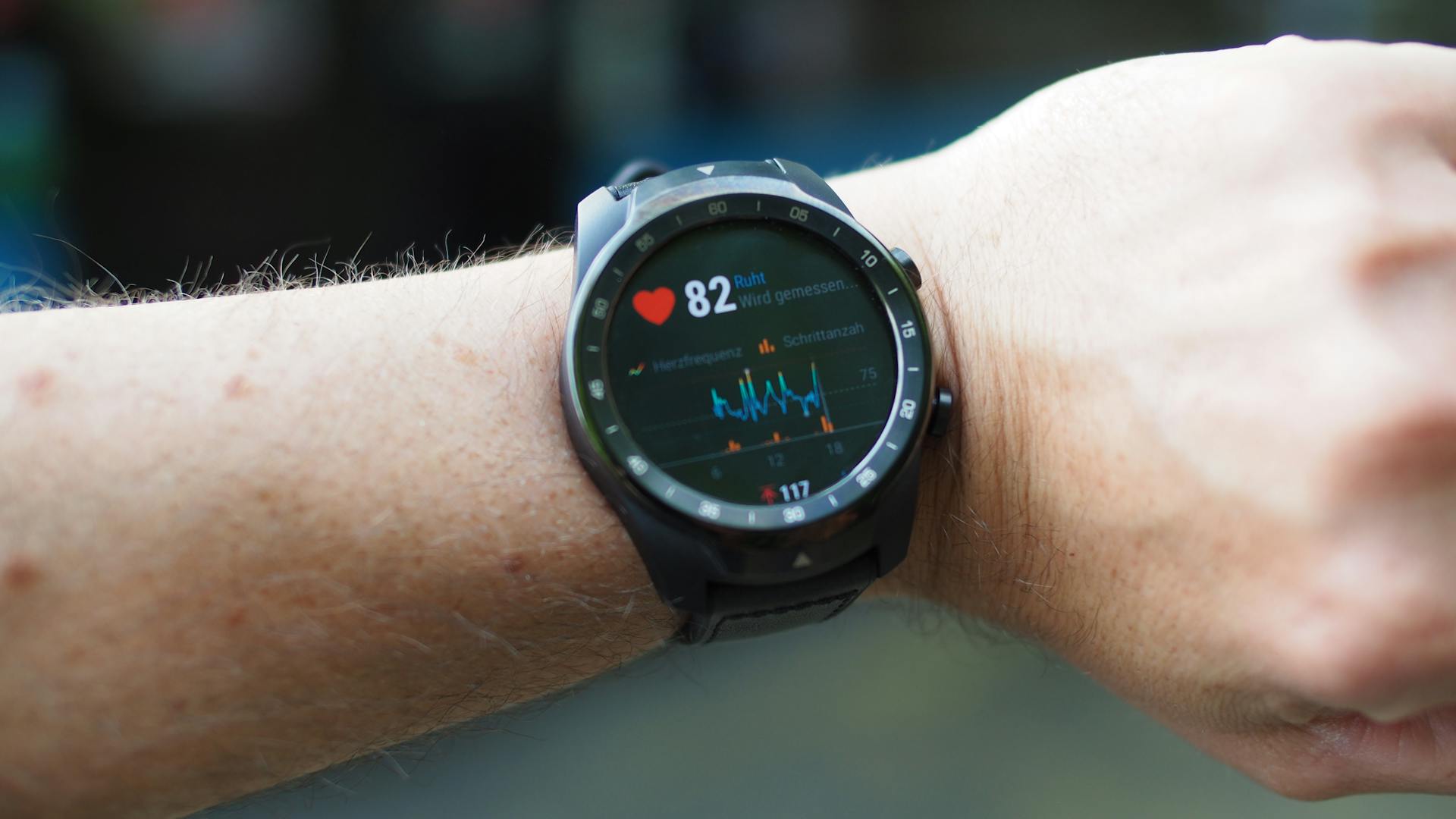 Person wearing heart rate monitor smartwatch during indoor training